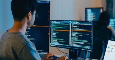 guy coding on computer