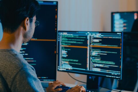 guy coding on computer