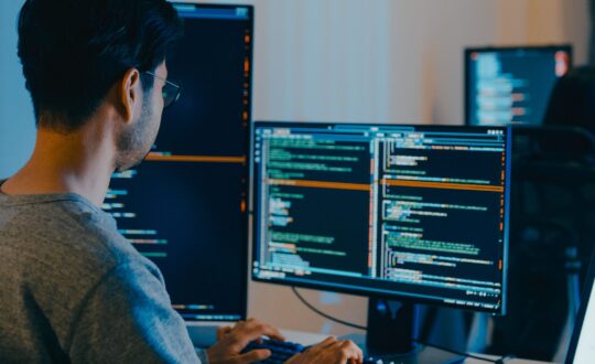 guy coding on computer