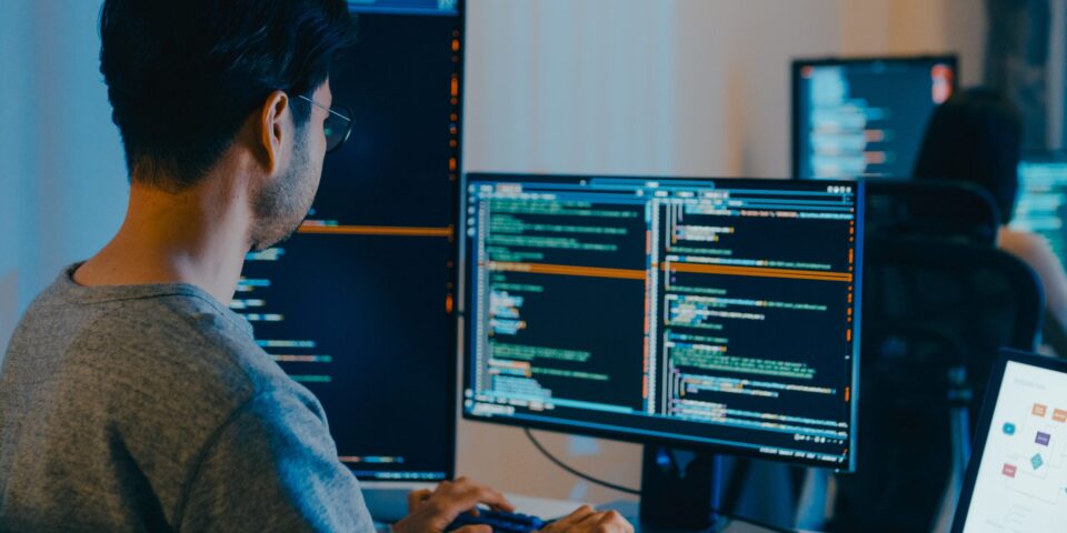 guy coding on computer