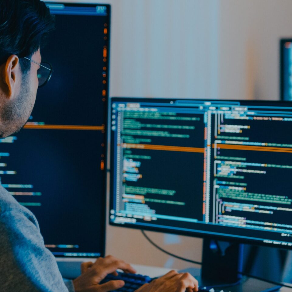 guy coding on computer