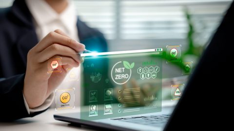 Businessperson,Analyzing,Net,Zero,Carbon,Dashboard,Hologram,,Showing,Co2,Emission