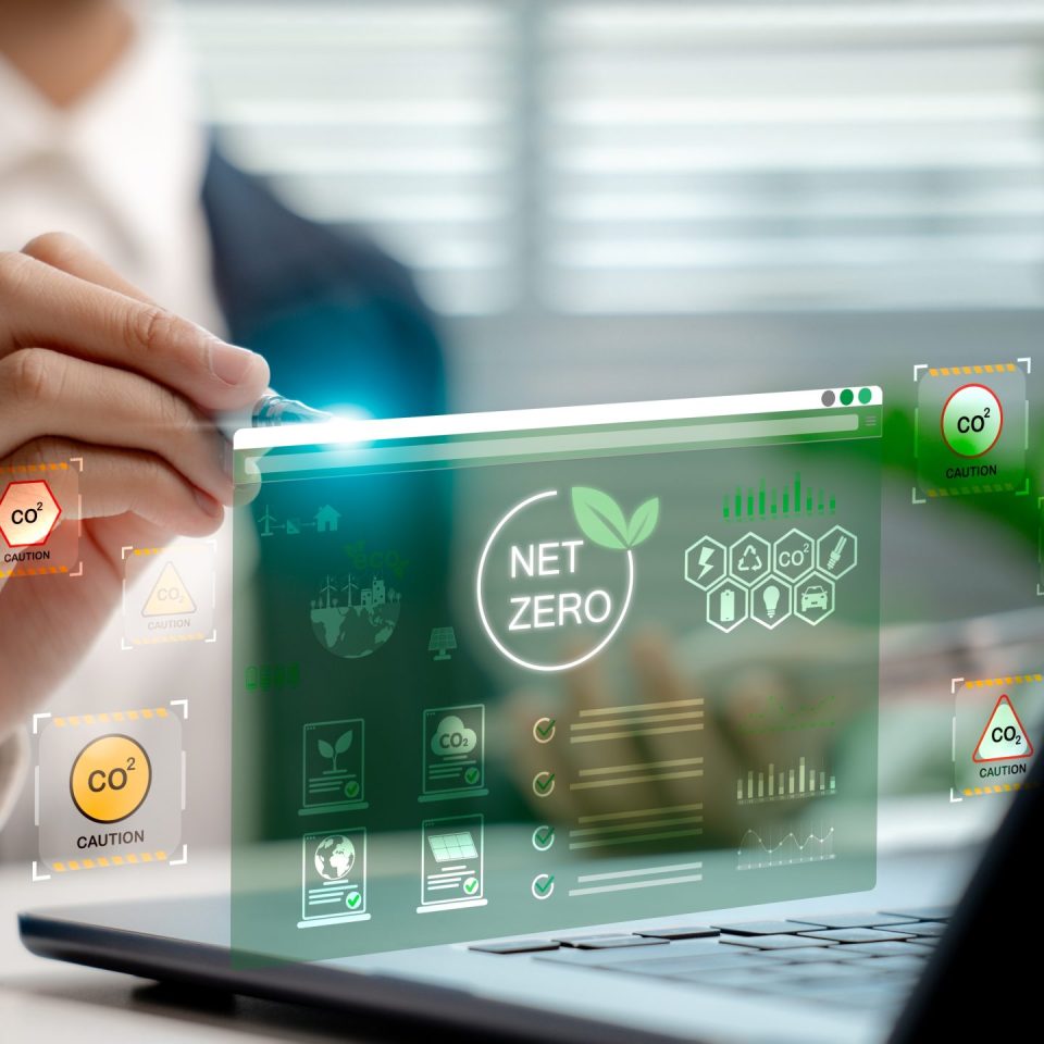 Businessperson,Analyzing,Net,Zero,Carbon,Dashboard,Hologram,,Showing,Co2,Emission